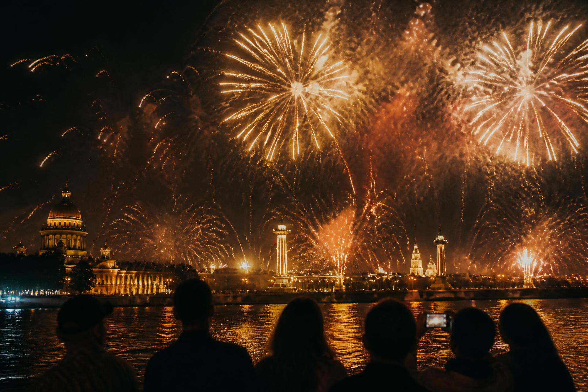 Cinematic golden fireworks over Saint Petersburg at night